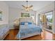 A primary bedroom with a balcony overlooking a colorful outdoor space at 240 108Th Ave # 102, Treasure Island, FL 33706