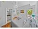 Comfortable bedroom with natural light, complemented by an ensuite bathroom at 240 108Th Ave # 102, Treasure Island, FL 33706