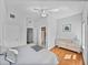 Bedroom featuring a double bed, windows with natural light and an ensuite bathroom at 240 108Th Ave # 102, Treasure Island, FL 33706