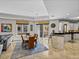 Dining area featuring modern table set, seamlessly connecting the living room and kitchen at 240 108Th Ave # 102, Treasure Island, FL 33706