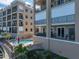 Upscale condo building featuring a pool and balconies overlooking the water at 240 108Th Ave # 102, Treasure Island, FL 33706