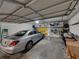 Garage features ample storage space, organization racks, and room for a car, bikes, and tools at 240 108Th Ave # 102, Treasure Island, FL 33706