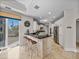 Bright kitchen boasts bar seating, marble floors, and stainless steel appliances at 240 108Th Ave # 102, Treasure Island, FL 33706