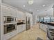 Spacious kitchen with stainless steel appliances, white cabinetry, and lots of natural light at 240 108Th Ave # 102, Treasure Island, FL 33706
