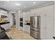 Bright kitchen with stainless steel appliances and granite counters next to lots of storage at 240 108Th Ave # 102, Treasure Island, FL 33706