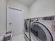 Efficient laundry room featuring modern washer and dryer units at 240 108Th Ave # 102, Treasure Island, FL 33706