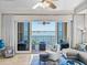 Comfortable living room with balcony access and beautiful waterfront views at 240 108Th Ave # 102, Treasure Island, FL 33706
