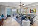 Bright living room with balcony access offering gorgeous water views at 240 108Th Ave # 102, Treasure Island, FL 33706