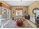 Cozy living room with balcony access, stylish furnishings, and a wine cooler at 240 108Th Ave # 102, Treasure Island, FL 33706