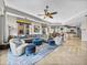 Spacious open floor plan with living, dining and kitchen areas with stylish decor and a large sectional sofa at 240 108Th Ave # 102, Treasure Island, FL 33706