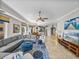 Bright and open living space with comfortable seating, modern decor, and views into the kitchen at 240 108Th Ave # 102, Treasure Island, FL 33706