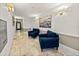 Inviting lobby area with comfortable blue chairs and stylish decor at 240 108Th Ave # 102, Treasure Island, FL 33706
