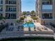 Relaxing pool and spa area offers a tranquil escape between two residential buildings at 240 108Th Ave # 102, Treasure Island, FL 33706