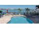 Beautiful pool and spa feature stunning views of the intercoastal waterway and docks at 240 108Th Ave # 102, Treasure Island, FL 33706