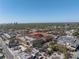 An aerial shot of townhomes near shopping and parking, nestled in a suburban setting with convenient amenities at 2402 W Azeele St # 423, Tampa, FL 33609