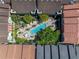Aerial view showing the community pool and manicured courtyard of this townhome community promoting outdoor living at 2402 W Azeele St # 423, Tampa, FL 33609