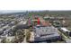 Aerial view of townhomes by parking and commercial spaces, indicating the convenient lifestyle and prime location at 2402 W Azeele St # 423, Tampa, FL 33609