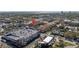 Aerial view displaying townhomes close to retail buildings and parking facilities, emphasizing a walkable neighborhood at 2402 W Azeele St # 423, Tampa, FL 33609