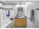 Well-lit bathroom with vanity, toilet, and shower-tub combo at 2402 W Azeele St # 423, Tampa, FL 33609