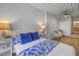 Well-lit bedroom shows seating area, and ensuite access adding comfort and style to the living space at 2402 W Azeele St # 423, Tampa, FL 33609