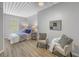 Cozy bedroom with a comfortable bed, soft lighting, and a chair for relaxation at 2402 W Azeele St # 423, Tampa, FL 33609