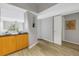 Hallway entrance to a living space, featuring light wood floors and neutral color walls at 2402 W Azeele St # 423, Tampa, FL 33609