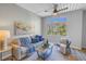 Bright living room featuring a comfortable sofa, accent chair, and large window with a view at 2402 W Azeele St # 423, Tampa, FL 33609