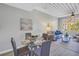 Comfortable living space featuring a dining table, sofa, and a view from the large window at 2402 W Azeele St # 423, Tampa, FL 33609