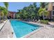 The community pool has lounge chairs for residents to enjoy at 2402 W Azeele St # 423, Tampa, FL 33609