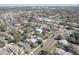 Birds-eye view of the neighborhood with varied home styles, mature trees and the skyline in the distance at 315 40Th S St, St Petersburg, FL 33711