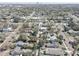 Neighborhood aerial view showcasing green trees, varying rooftops, and a city skyline in the background at 315 40Th S St, St Petersburg, FL 33711