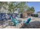 Backyard seating area with fire pit, Adirondack chairs, privacy fence, and pergola at 315 40Th S St, St Petersburg, FL 33711