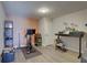 Versatile basement area with workout equipment, home office setup, and ample space at 315 40Th S St, St Petersburg, FL 33711