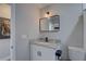 Neat bathroom featuring granite countertops, dark hardware, and modern lighting at 315 40Th S St, St Petersburg, FL 33711