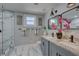 Modern bathroom features marble floors, a glass enclosed shower, and dual sink vanity at 315 40Th S St, St Petersburg, FL 33711