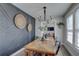 Stylish dining room highlights contemporary lighting, unique wall decor, and wood table at 315 40Th S St, St Petersburg, FL 33711