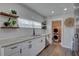 Functional kitchenette shows white subway tile, wood accents, and convenient laundry area at 315 40Th S St, St Petersburg, FL 33711