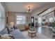 Sunlit living room features neutral walls, modern lighting, and sleek wood flooring at 315 40Th S St, St Petersburg, FL 33711
