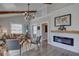 Charming living room with a modern fireplace, beamed ceilings, stylish decor, and comfortable seating at 315 40Th S St, St Petersburg, FL 33711