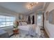 Relaxing bedroom offers a cozy bed, natural light, and an attached bathroom at 315 40Th S St, St Petersburg, FL 33711