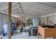Interior of shed containing belongings, including bins, boxes, and other storage items at 315 40Th S St, St Petersburg, FL 33711