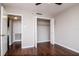 Bedroom features wood floors and a closet for storage at 3211 W Swann Ave # 502, Tampa, FL 33609