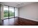 Bright bedroom with a sliding glass door to the balcony at 3211 W Swann Ave # 502, Tampa, FL 33609