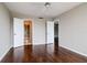 Bedroom with wood floors and two entries at 3211 W Swann Ave # 502, Tampa, FL 33609