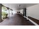 Arched covered garage with brick pavers and access to building and parking at 3211 W Swann Ave # 502, Tampa, FL 33609