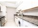 Kitchen with tile flooring, granite countertops and stainless appliances at 3211 W Swann Ave # 502, Tampa, FL 33609