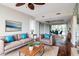 Cozy living room featuring hardwood floors, comfortable seating, and seamless transition to the dining area at 3211 W Swann Ave # 502, Tampa, FL 33609