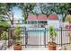 Community pool with a covered seating area and lush landscaping creating a tranquil outdoor space at 3211 W Swann Ave # 502, Tampa, FL 33609