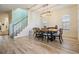 Bright dining area with modern chandelier and seating for six at 409 Winterside Dr, Apollo Beach, FL 33572