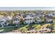 Charming two-story homes in a vibrant community, featuring lush landscaping and inviting front porches at 409 Winterside Dr, Apollo Beach, FL 33572